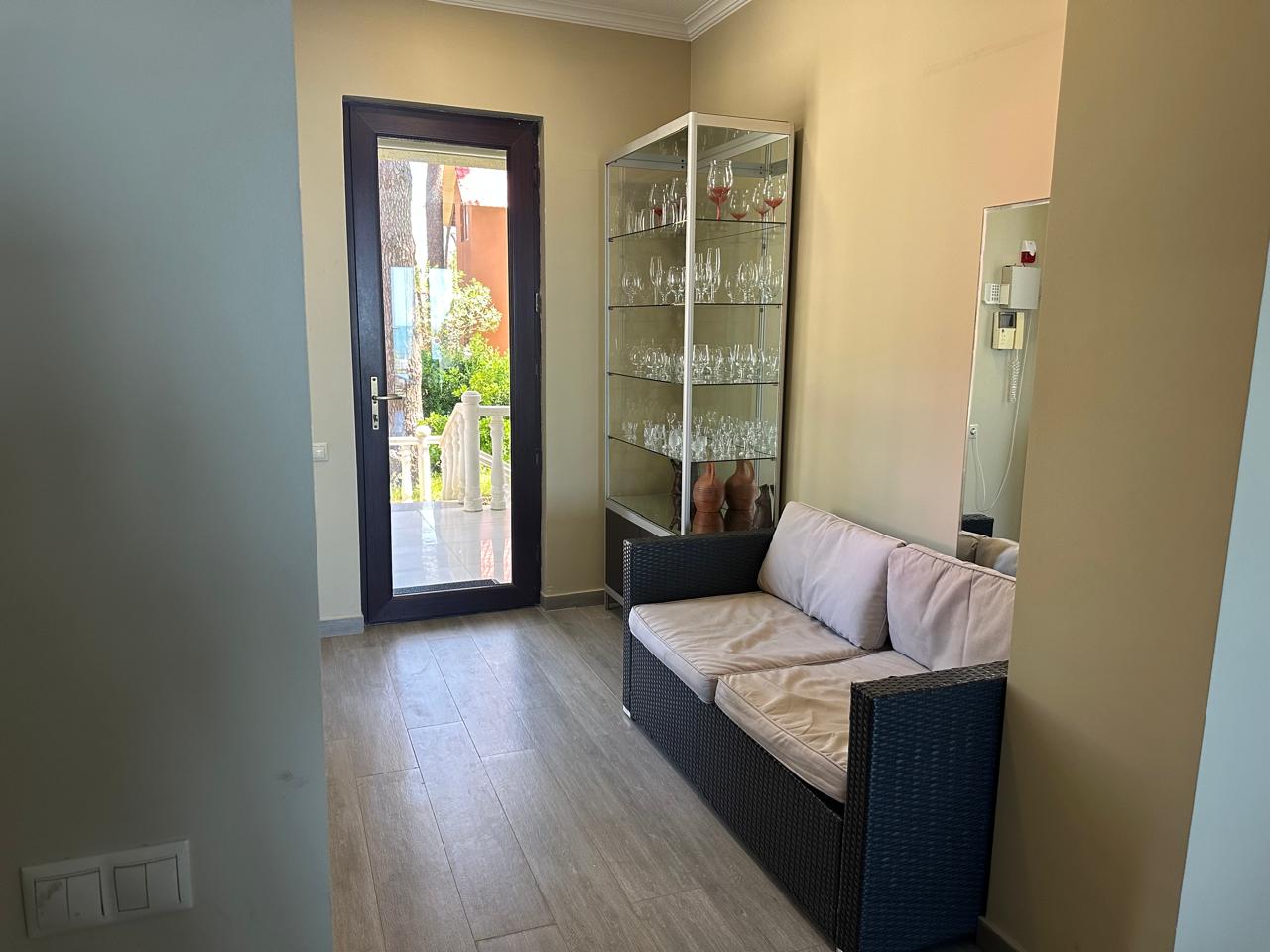 Entry lounge with glassware cabinet